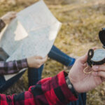 close-up-hiker-with-compass-his-hand